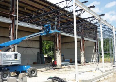 a crane lifting a metal frame